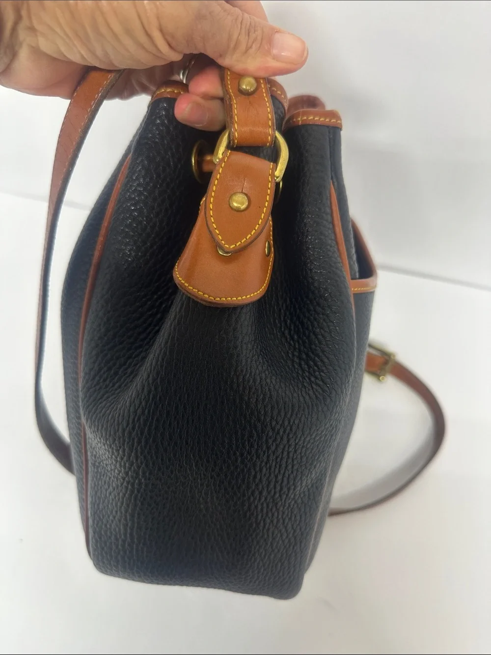 Dooney & Bourke Black Pebbled Leather Drawstring Bucket Bag with Tan Trim